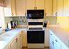 The kitchen is well stocked for preparation of in house meals with adjacent pantry and laundry room.