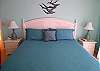 The master suite offers a king bed, new flat screen TV, screened porch and private bath