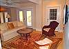 Downstairs den with comfortable seating and flat screen TV