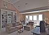 The upstairs den has an oceanfront deck and TV. Its a great place for the young people to gather