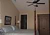 King suite with high ceilings and hardwood flooring