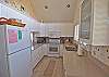 Recently updated kitchen with new counter tops, cabinets and tile flooring