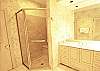 Master bath has a double vanity, separate shower and deep, garden tub