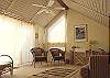 One level up, the loft is a quiet area to catch up on reading, surf the internet, or nap. Sleeper sofa here. Access to sundeck too.