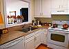 Kitchen has newer counter tops and appliances with a nice wood floor