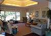 Architectural details include lighted tray ceiling and wainscoting