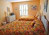 A great room with two double beds and TV. Share 1.5 baths with the other bedroom. This bedroom is also located on the first level of the home.
