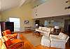 Well appointed, spacious living area with vaulted ceiling and upstairs loft