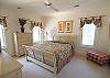 This beautifully decorated queen bedroom is on the first level.  Full bath right next to this bedroom