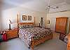 The master suite has a king bed, private bath with shower and garden tub and access to the deck overlooking the lagoon