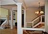 Come up the stairs into the great room staircase leads upstairs to guest bedrooms and loft study area.