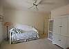 Located on the main level this trundle bedroom has a TV in the armoire and shares a bath with the queen bedroom