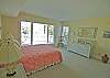 Spacious bedroom with queen bed and access to the full bath from the bedroom