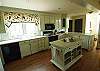 Kitchen is open and spacious with plenty of cookware