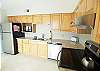 Granite counter tops, stainless appliances, and new tile flooring