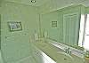 The master bath has a double vanity, and garden tub/shower combo