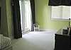 Located upstairs this bedroom offers a full bath and outside deck.  It is unfurnished.