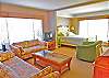 Located on the lower level with a large sitting area with TV and access to the screened porch