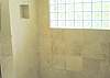 Huge marble and limestone tile shower