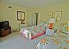 Twin beds, access to the screened porch, TV and shares bath with queen bedroom