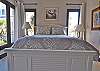 Comfortable new bedding on this queen bed for 2013 season
