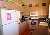Fully appointed kitchen with Corian counter tops and eat in area