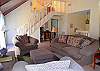 Another view of the living room looking back towards the master bedroom and stairs leading to the sundeck level