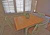 Kitchen has an eat in area with a table that seats 4