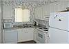 Bright and well appointed with updated appliances, newer cabinets and counter tops and wood flooring