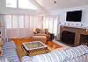 Huge flat screen digital TV, vaulted ceiling, lots of comfortable seating, and deck with gas grill