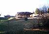 This cottage style home boasts a wrap around covered deck and large yard.