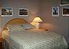Queen size bed, ceiling fan and window a/c/.