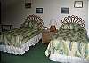 Twin beds, ceiling fan. Bath room in loft.