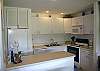 New kitchen cabinets, recessed ceiling lights.