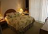Queen bed, ceiling fan, window a/c