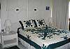 Queen size bed, ceiling fan, window a/c.