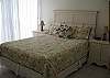 Queen size bed.  Ceiling fan, new furniture, window a/c.
