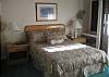 Queen size bed, window a/c, ceiling fan.
