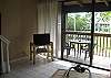 View from Living Room to garden area and pool.