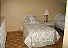 Twin beds, ceiling fan. Bath has shower.
Sleeping area open to living room.