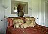 King bed in Master bedroom overlooking the golf course. Window a/c and ceiling fan. Has TV in bedroom.