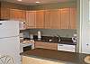 New kitchen cabinets, appliances, Corian counter tops.