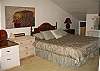 King size bed, ceiling fan.