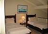 Twin beds, ceiling fan.
