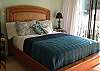 Queen size bed, ceiling fan and window a/c.
