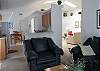 ...view from the family room towards the kitchen and the living room on the right...