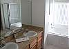 ...the Master bathroom, with dual vanity, large garden tub and separate walk-in shower...