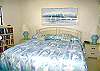 Central Gulf Coast Condominium rental - Interior Photo - A view of our master bedroom with a TV views through the balcony