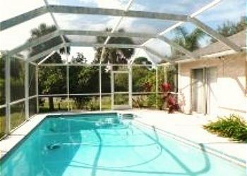 Central Gulf Coast House rental - Exterior Photo - Relax in our beautiful pool and screened in lanai