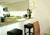 Central Gulf Coast Condominium rental - Interior Photo - A view of our kitchen and dining area with 2 bar stools
